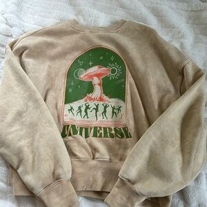 soft mid length sweatshirt with tan and green colors and a funky design!